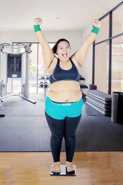 Fat woman feels happy after her checkup in clinic — Stock Photo, Image