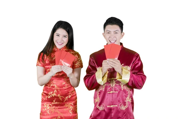 Two Asian people holding their angpaos happily — Stock Photo, Image