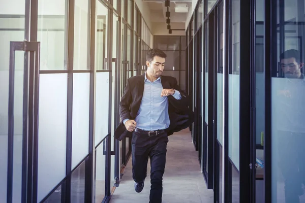 Asian businessman running on the office hallway — Stock Photo, Image