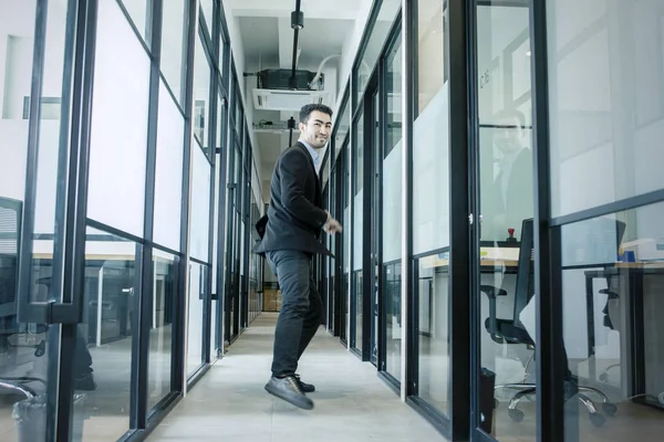 Handsome Asian businessman running with style — Stock Photo, Image