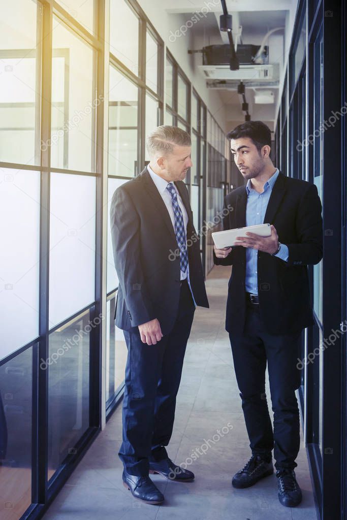 Businessman showing business plan to his boss