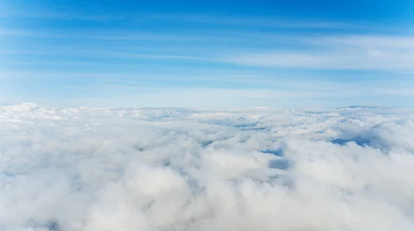 Airplane view of clouds filling the atmosphere — 스톡 사진