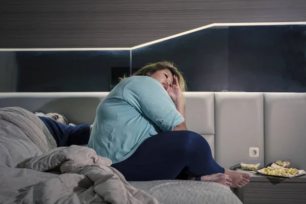 Fat woman annoyed because of her husband snoring — 스톡 사진