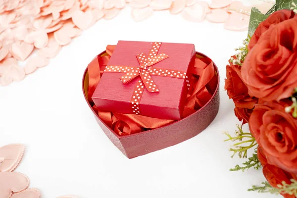 Ribbons and gift box with knick knacks surrounding — 스톡 사진