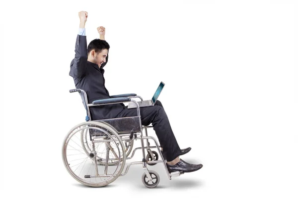 Businessman expressing his success on wheelchair — Stock Photo, Image