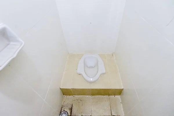 op down view of a dirty squat toilet