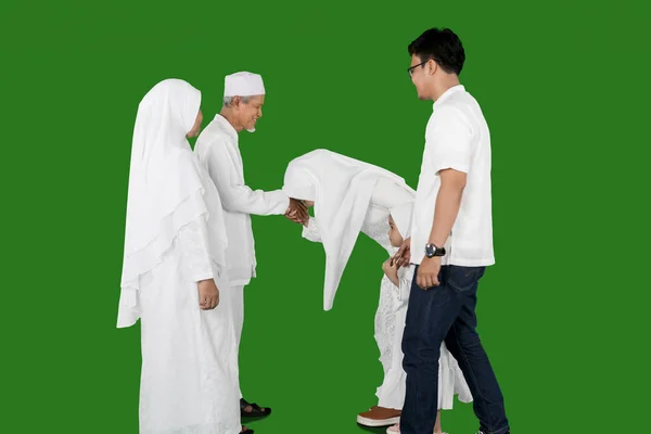 Indonesian young family Eid al-fitr celebration in studio — Stock Photo, Image