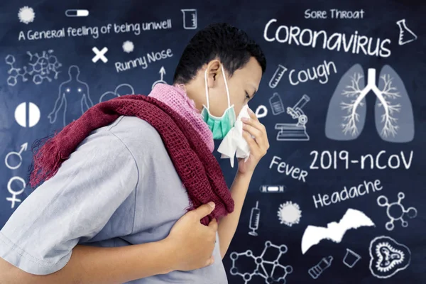 Zieke man niest zijn neus geïsoleerd in schoolbord — Stockfoto