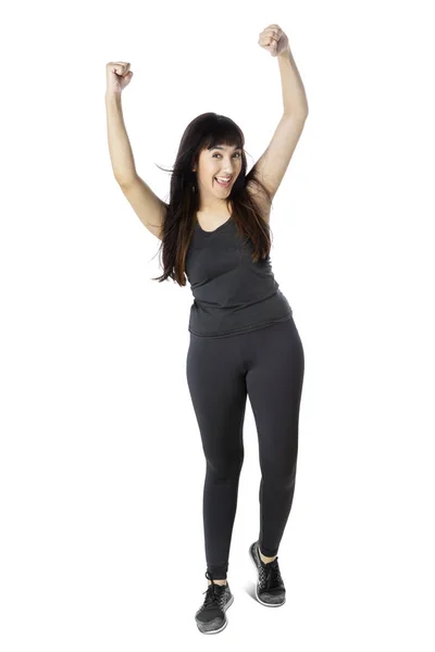Woman in sportswear expressing her success — Stock Photo, Image