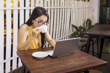 Woman enjoying leisure time with a cup of coffee