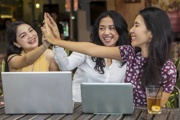 Cheerful university students doing high five in cafeteria — Stock Fotó