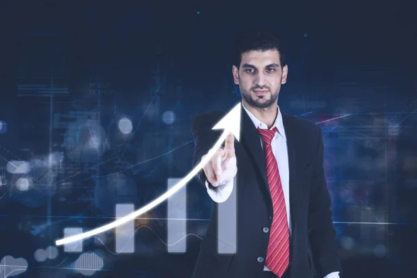 Young businessman touching arrow up on interface screen — Stock Photo, Image