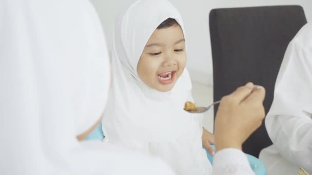 Muslim Little Girl Having Feed Her Grandmother — Stock Video