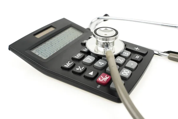 Closeup Stethoscope Attached Calculator Isolated White Background — Stock Photo, Image