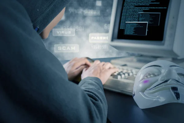 Picture Male Hacker Stealing Information System Clown Mask Table — Stock Photo, Image