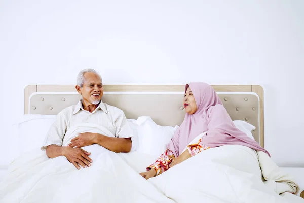 Portrait Senior Muslim Couple Talking Each Other While Sitting Bedroom — Stock Photo, Image