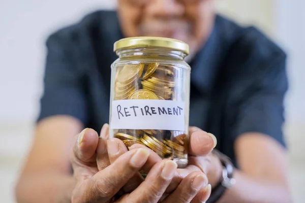 Elderly Man Hand Showing Jar Full Golden Coins Retirement Text — Stock Photo, Image