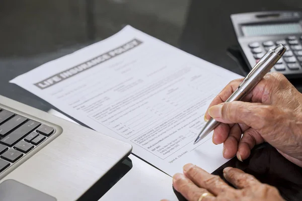Senior Man Hand Signing Life Insurance Claim Form Table Home — Stock Photo, Image
