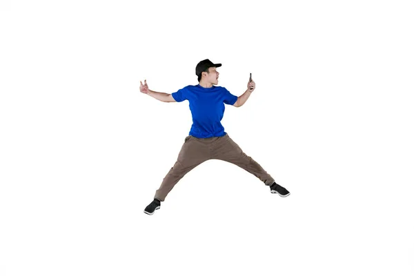 Portrait Young Man Leaping Air While Holding His Smartphone Isolated — Stock Photo, Image