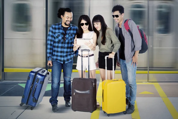 Portrait Group Young People Looking Digital Tablet While Standing Train — Stock Photo, Image