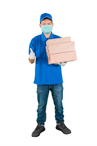 Homem Vestindo Uniforme Entrega Azul Máscara Facial Levantar Pilha Embalagens — Fotografia de Stock