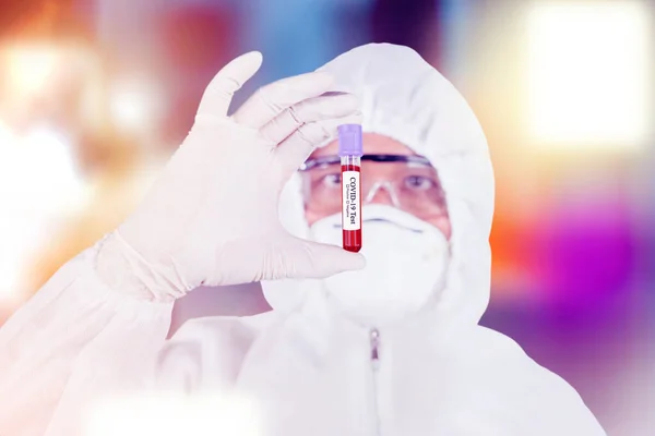 Closeup Unidentified Scientist Wearing Hazmat Suit While Holding Covid Blood — Stock Photo, Image