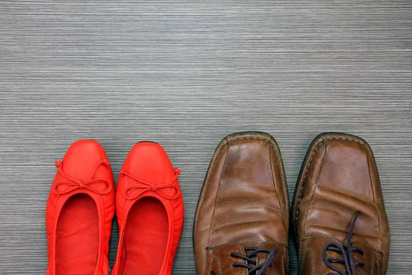 Shoes of a man and a woman on the floor.Fashion accessories.