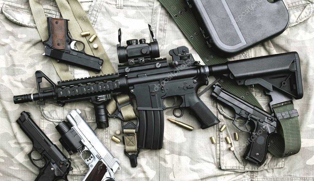 Weapons and military equipment for army, Assault rifle gun (M4A1) and pistol on camouflage background.