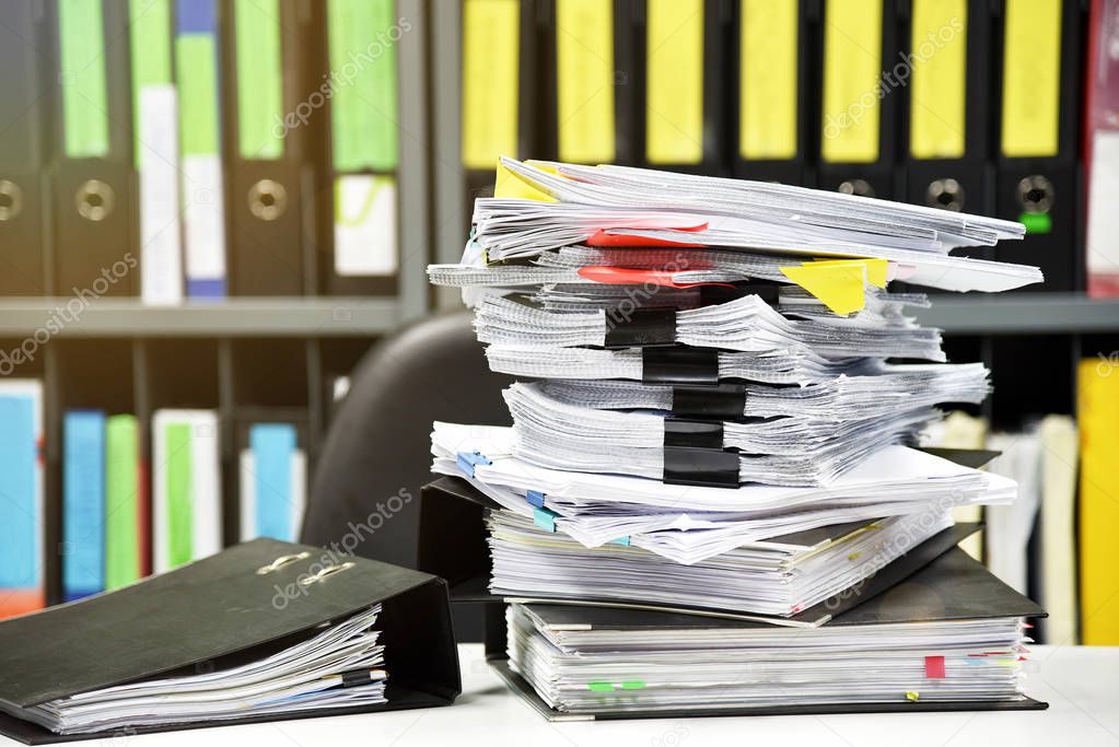 Lot of work, Stacks of document paper and files folder on office desk.