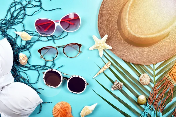 Sunglasses, Summer and sun protection concept, Summer travel essentials preparation, Travel accessories, bikinis and hat.
