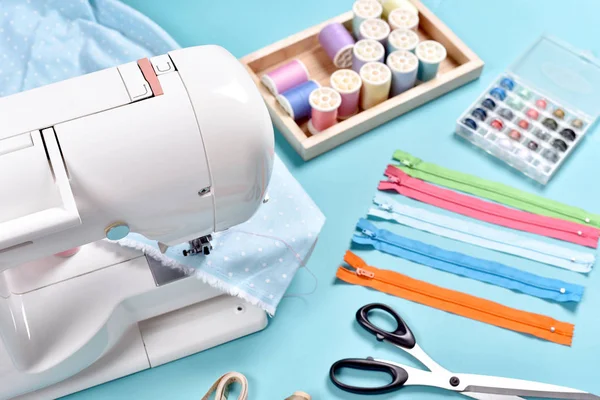 Pastel color background, Dressmaker and designer desk, Sewing machine and handcraft accessories. — Stock Photo, Image