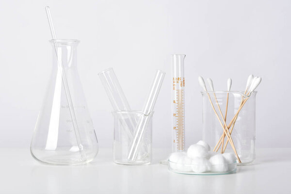 Group of scientific laboratory glassware with clear liquid solution, Science research and development concept.