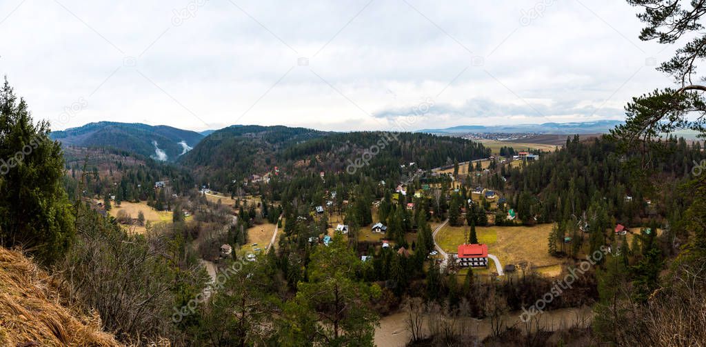 Slovakia: Panorama view of small huts and village on the countryside. Meadow, forest and hills.