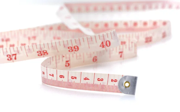White centimeter isolated on a white background - measuring tape Stock Picture