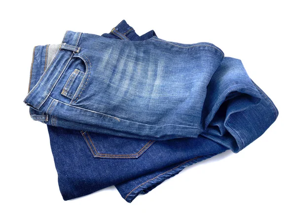 Несколько синих джинсов, изолированных на белом — стоковое фото