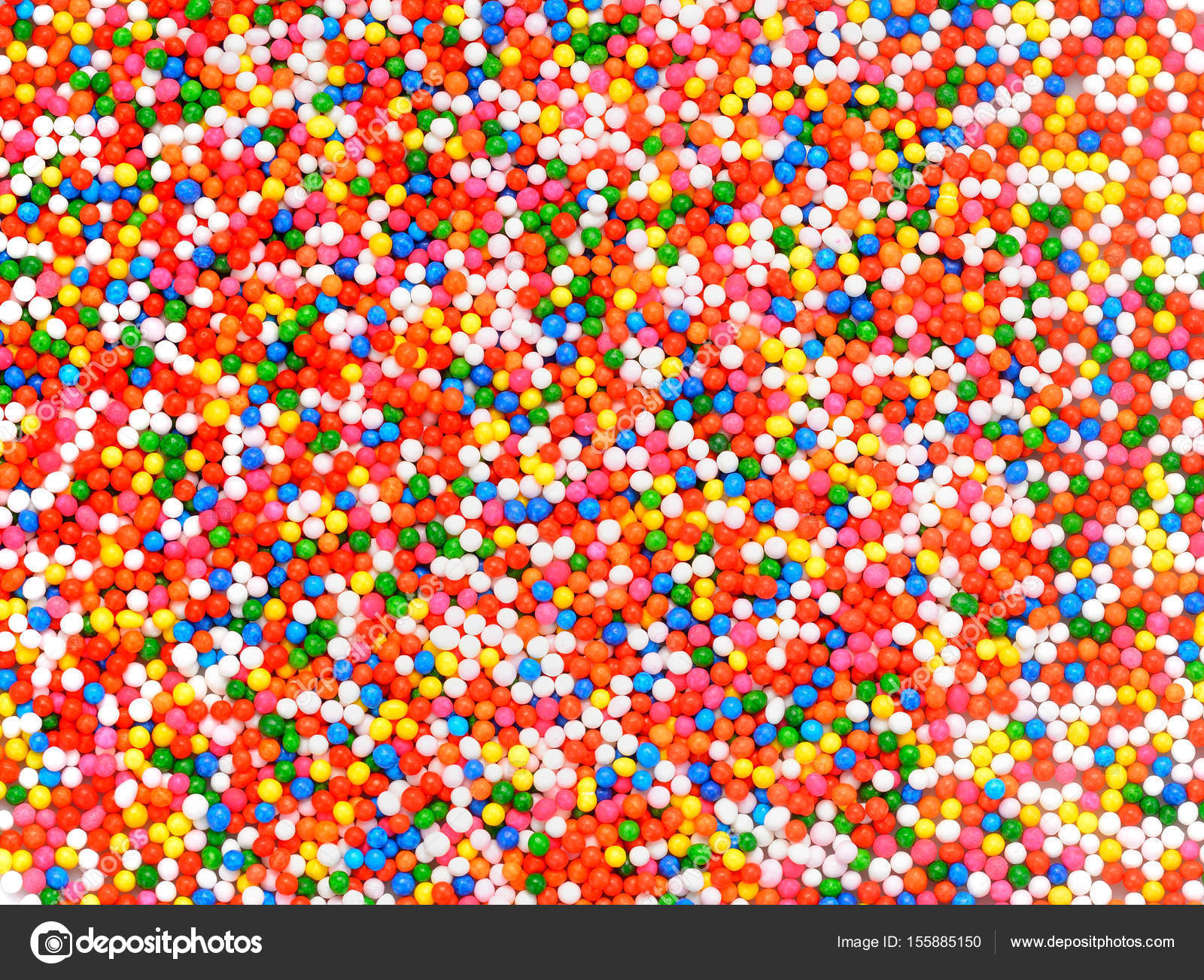 Background of colorful sprinkles, jimmies for cake decoration or ice