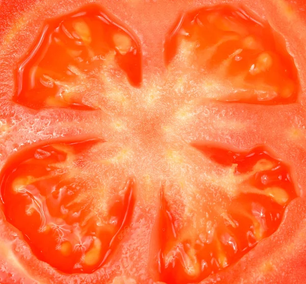 Tomatoes slices. Tomatos background, close-up section of juicy r — Stock Photo, Image