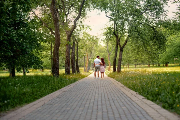 Family love couple in the forest park on a Fairy tale road Stock Photo