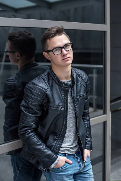 Young handsome student guy in black Leather Jacket — Stock Photo, Image