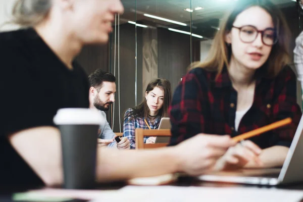 Young business people working at a new project in modern loft — Stock Photo, Image