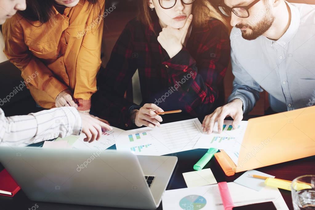 Human hands with paper, gadget and notebook during discussion