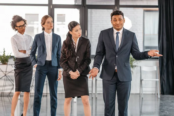 Young businesspeople in formalwear at modern office — Stock Photo, Image