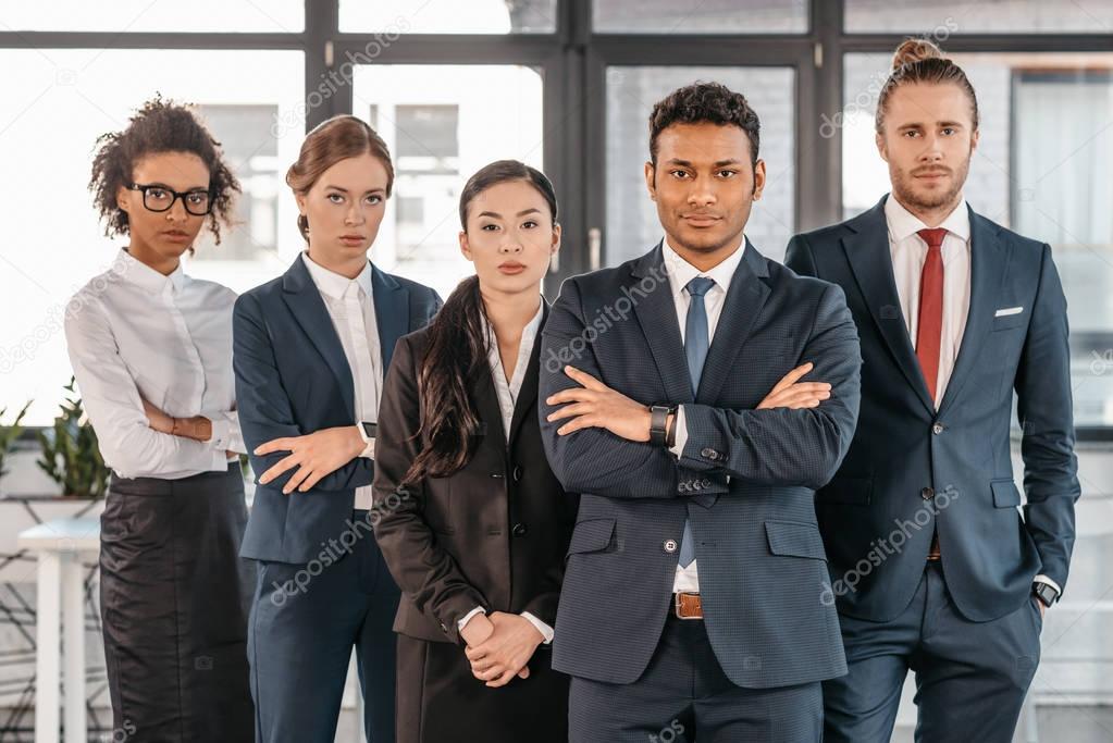 young businesspeople in formalwear at modern office