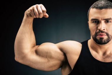 strong man showing muscles clipart