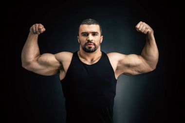 strong man showing muscles clipart
