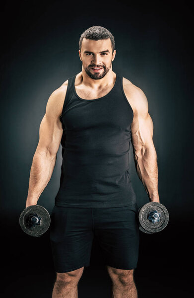 man with dumbbells in hands
