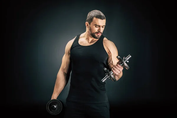 Sportive man pumping muscles — Stock Photo, Image