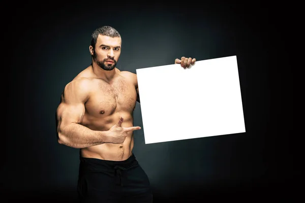 Athletic man with blank banner — Stock Photo, Image