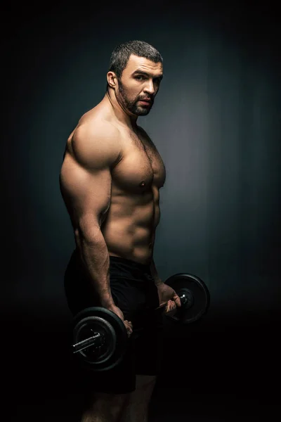 Athletic man weightlifting — Stock Photo, Image