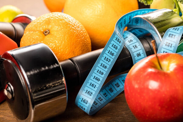 healthy food and sports equipment